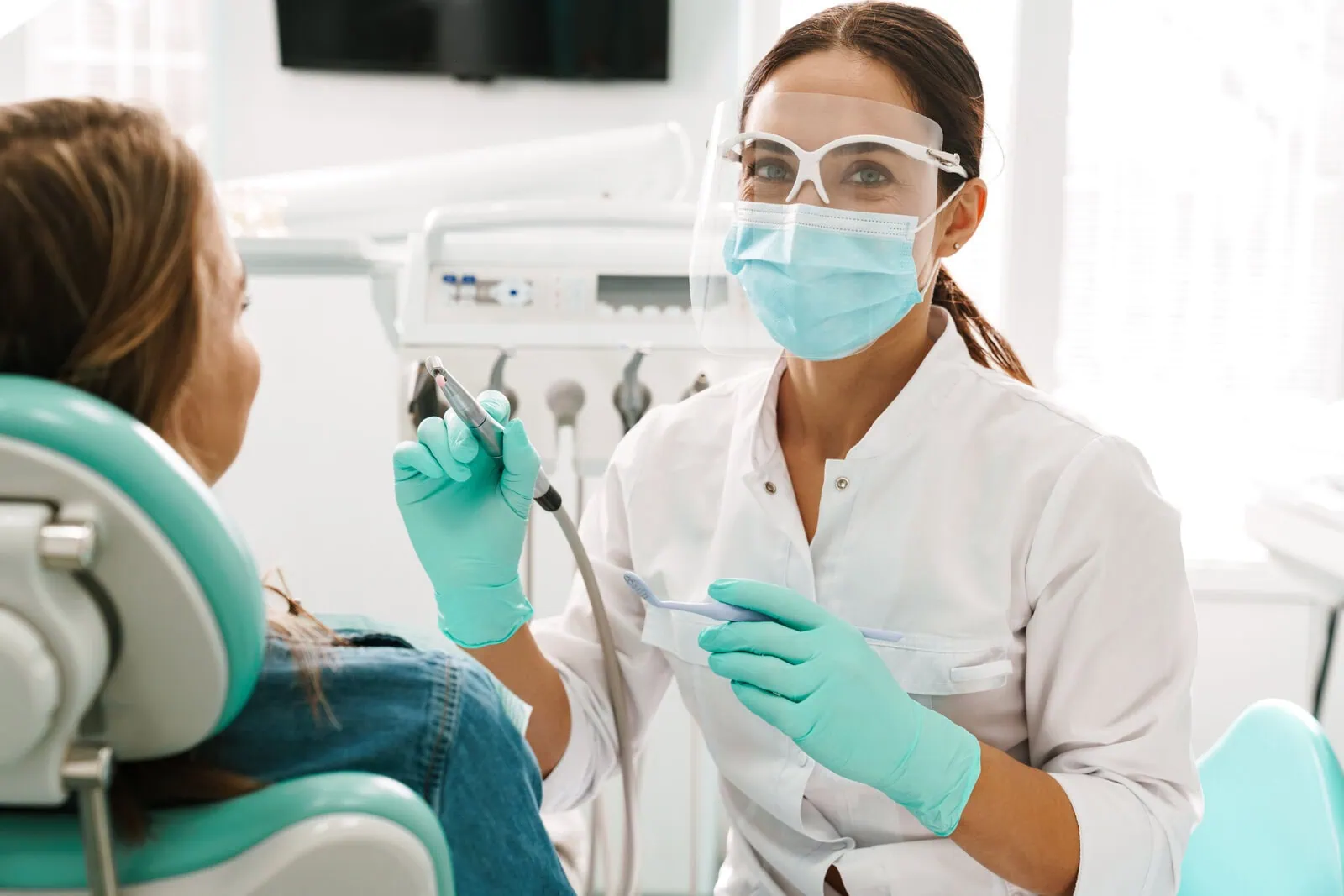 Dr. Kass Nourishad and the First Dental Implant Center team