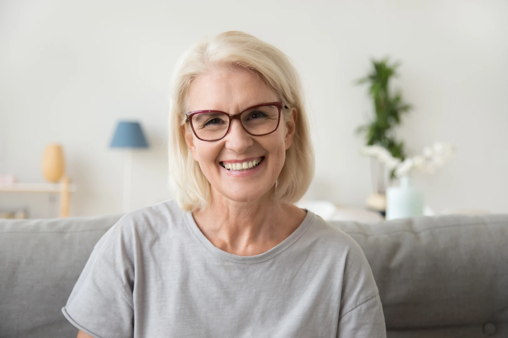 Confident smile after a cosmetic dentistry makeover at First Dental Implant Center
